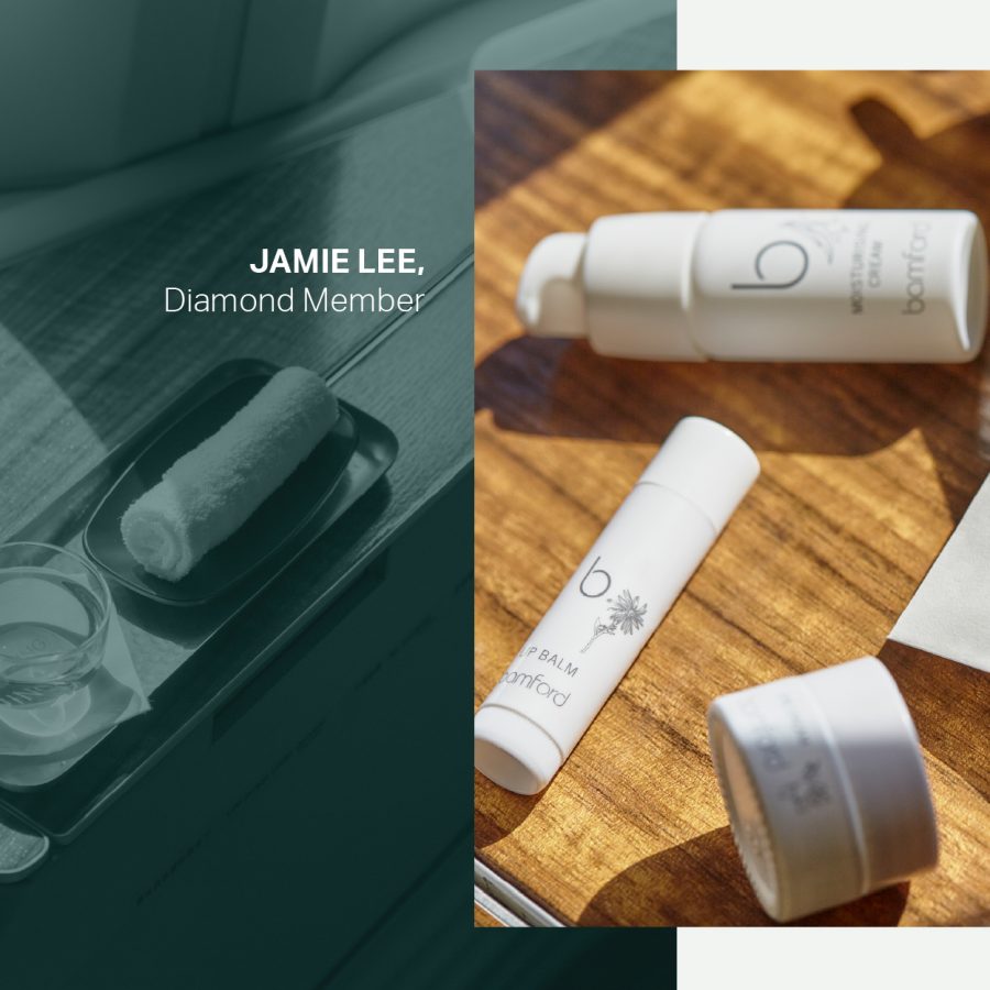 Bamford amenities spread on a tray table on a Cathay aircraft.